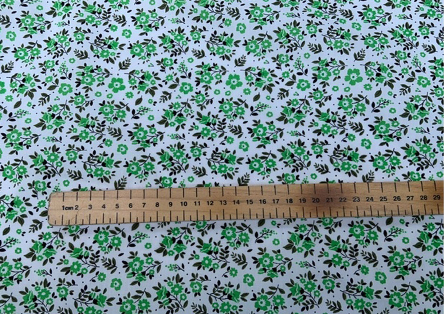 Green flowers on white polycotton print