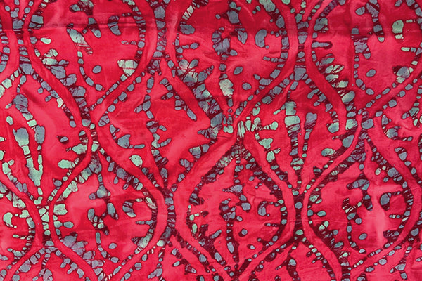 Cerise/Red batik print with teardrop style pattern
