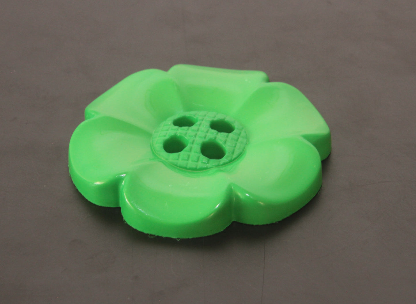 Oversized plastic buttons in flower shape