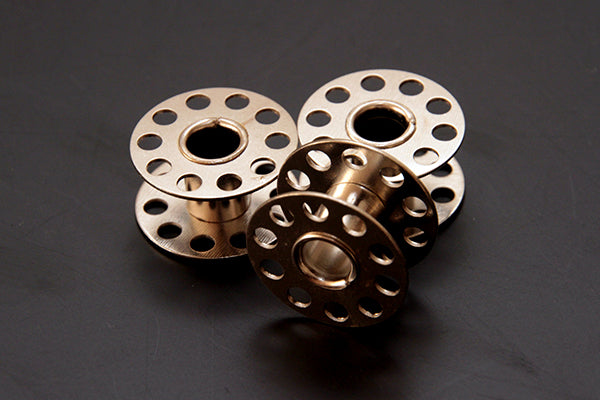 Sewing machine metal bobbins