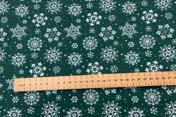 Christmas polycotton, white snowflake on green