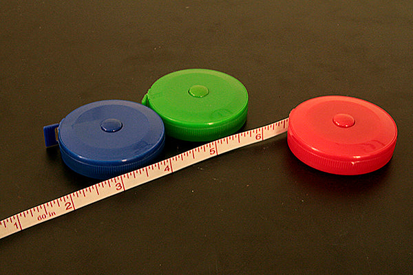 Spring loaded tape measure