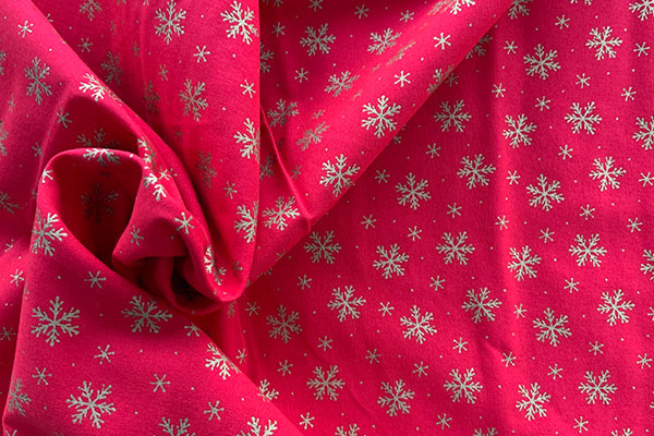 Gold snowflakes on red 100% cotton