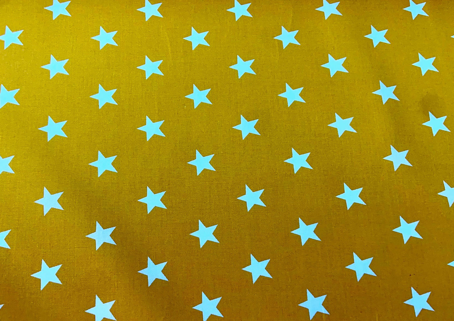 White stars on yellow cotton print