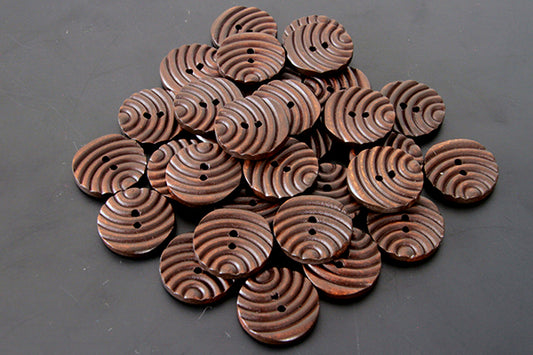 Large brown groove button
