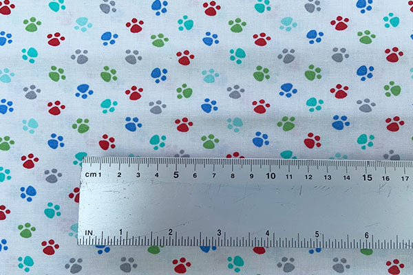 Colourful paw prints on white 100% cotton print