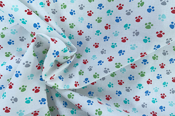 Colourful paw prints on white 100% cotton print