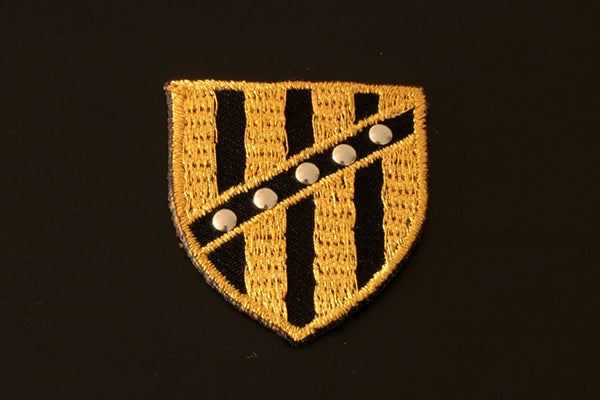 Gold and black shield style iron-on motif