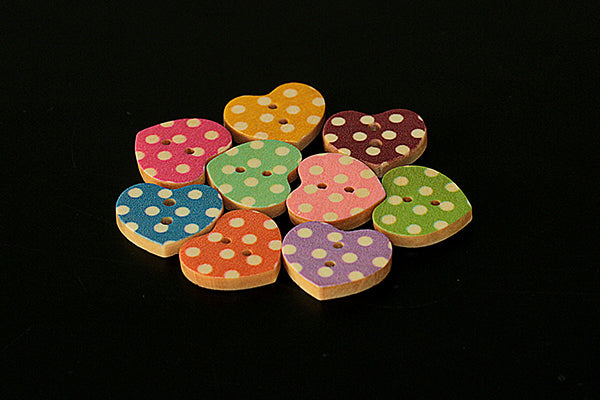 Wooden heart button with spotty design