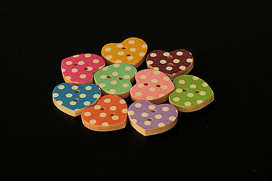 Wooden heart button with spotty design