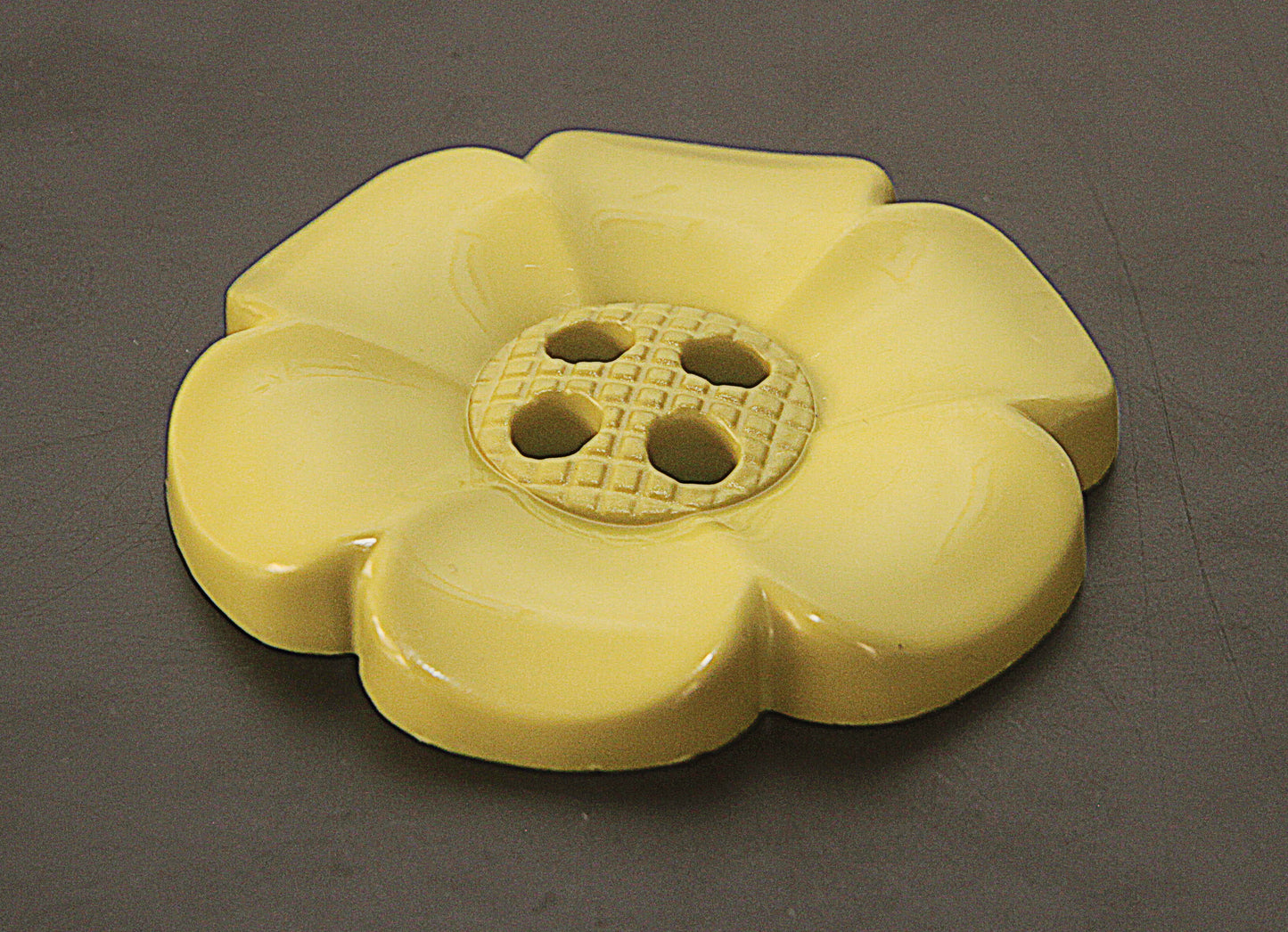 Oversized plastic buttons in flower shape