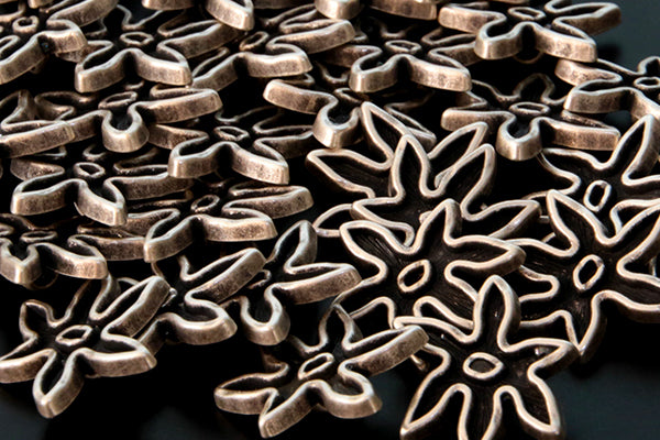 Antique silver & black flower shaped metal shank buttons, pointed petals
