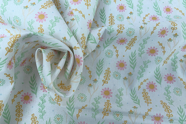 Orange and green floral on white background 100% cotton print