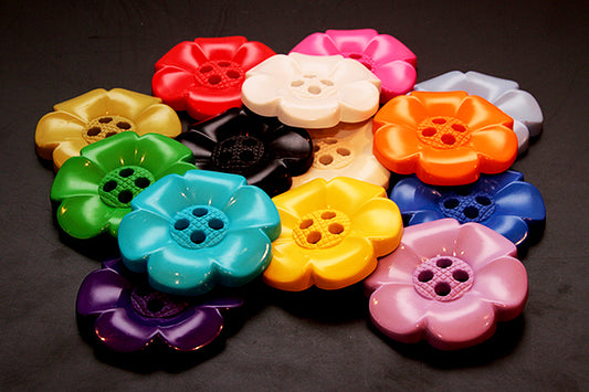 Oversized plastic buttons in flower shape