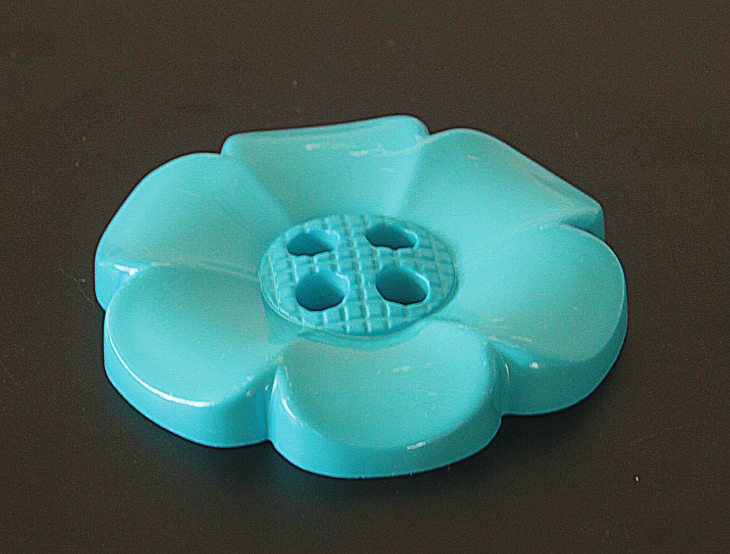 Oversized plastic buttons in flower shape